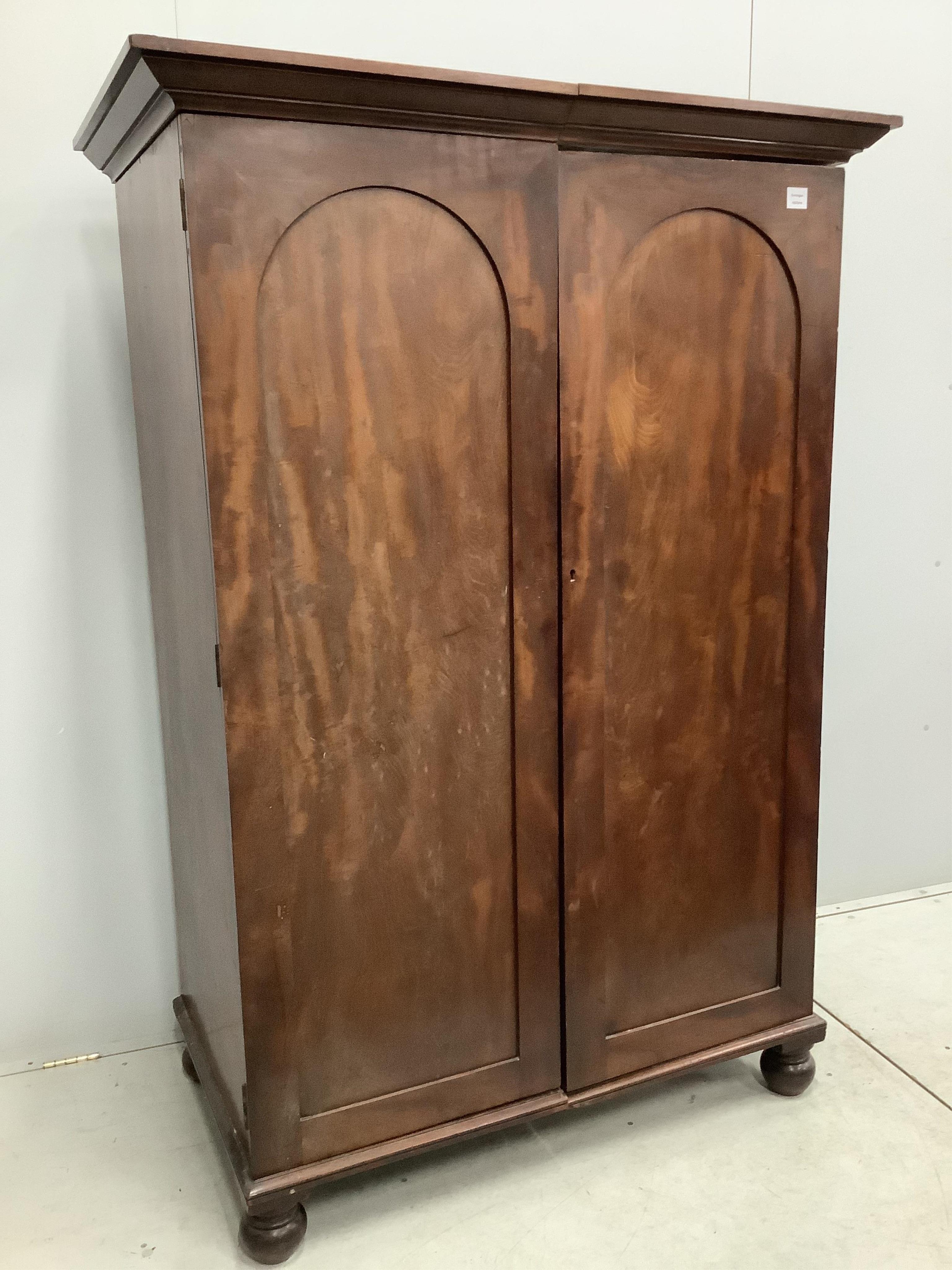 A Victorian mahogany two door hanging wardrobe, adapted, width 119cm, depth 67cm, height 175cm. Condition - poor